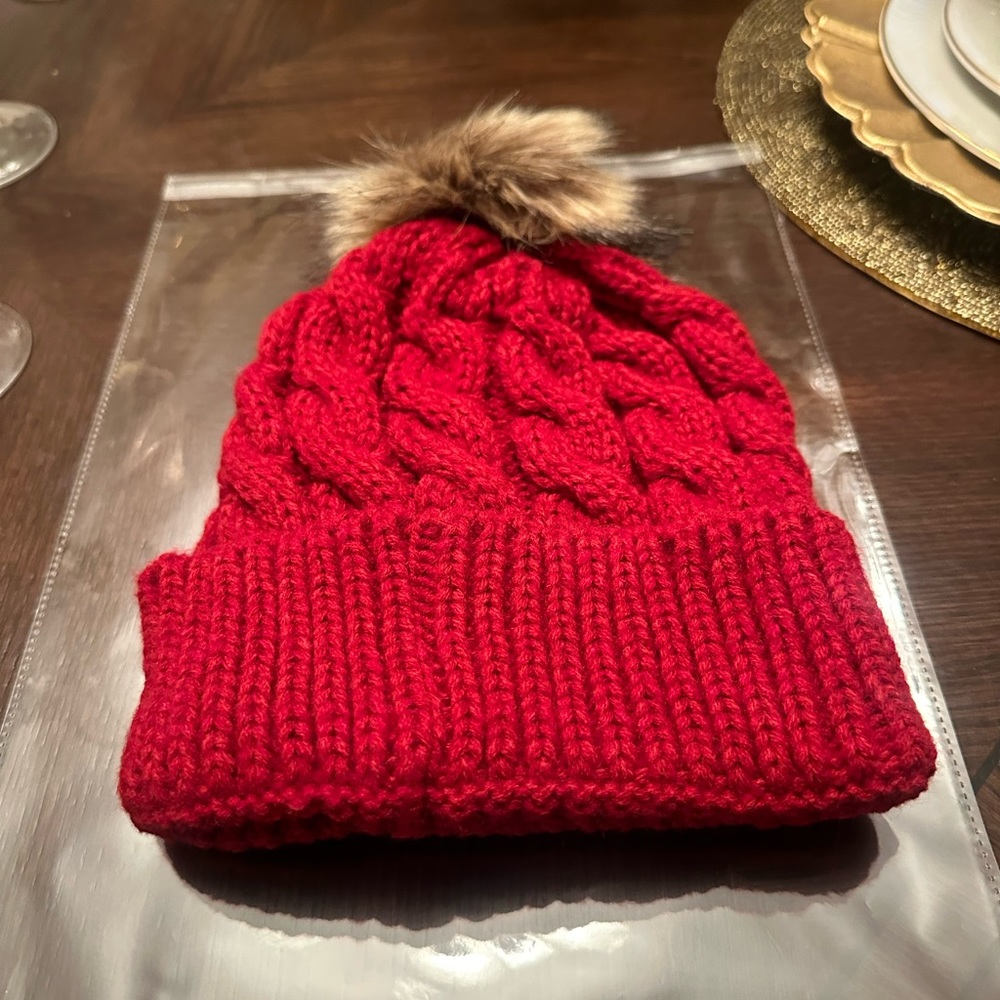 New in packaging. Women Dark Red Puff Beanie Just in Time for the Coldness